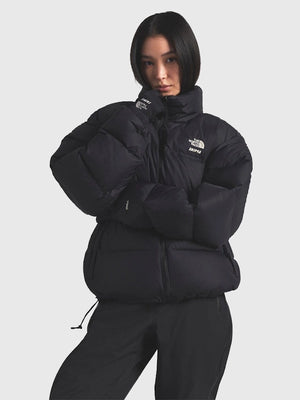 Recreated The North Face × SKIMS 1996 Nuptse parachute puffer jacket in black with insulated warmth and streamlined silhouette.