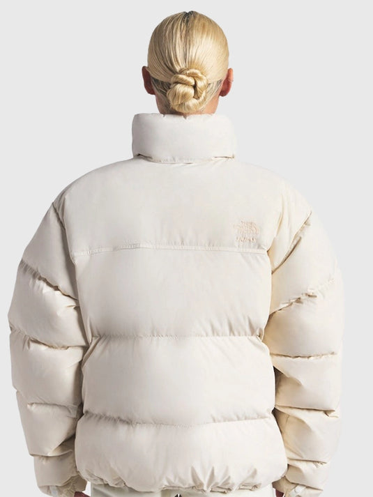 Off-white Nuptse puffer jacket recreated from The North Face × SKIMS 2025 drop featuring lightweight parachute fabric and warm fit.
