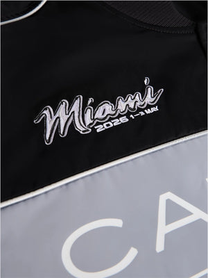 Tommy Hilfiger x Cadillac F1 Team Varsity Jacket showcasing Miami-themed design, contrast paneling, and a timeless varsity style