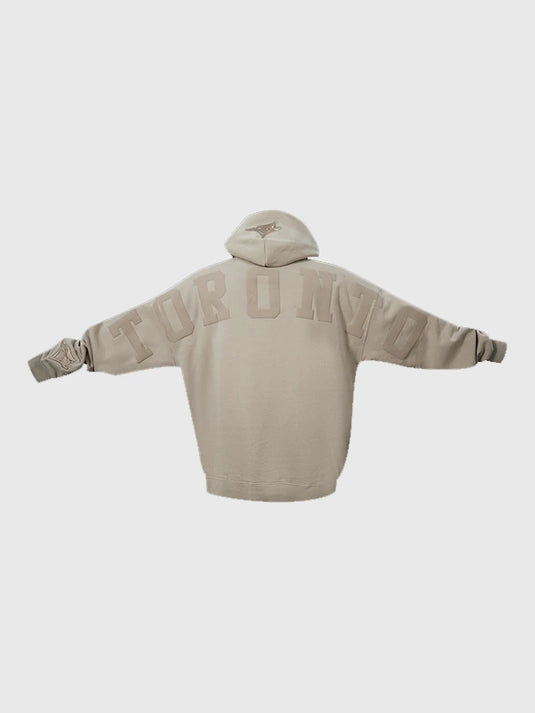 Toronto Blue Jays light brown pullover hoodie with Wingspan logo and relaxed drop shoulder style.