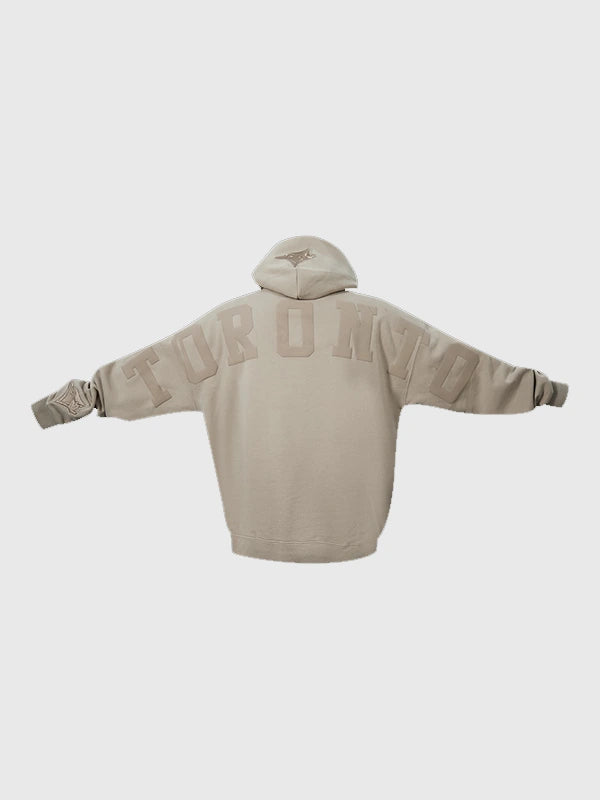 Toronto Blue Jays light brown pullover hoodie with Wingspan logo and relaxed drop shoulder style.