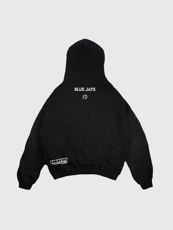 Black Toronto Blue Jays and The Weeknd 2025 Legacy Hoodie featuring World Series graphics and soft fleece fabric.