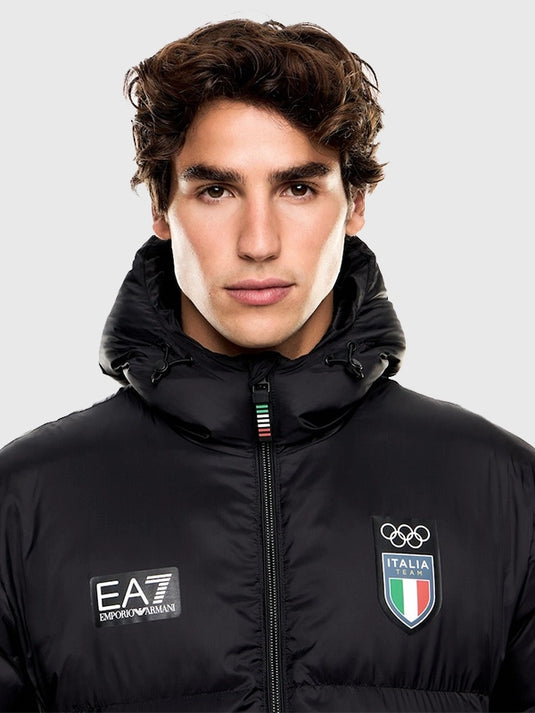Black hooded parachute puffer jacket linked to Milano Cortina 2026 Winter Olympics showcasing EA7 Emporio Armani’s technical sportswear approach