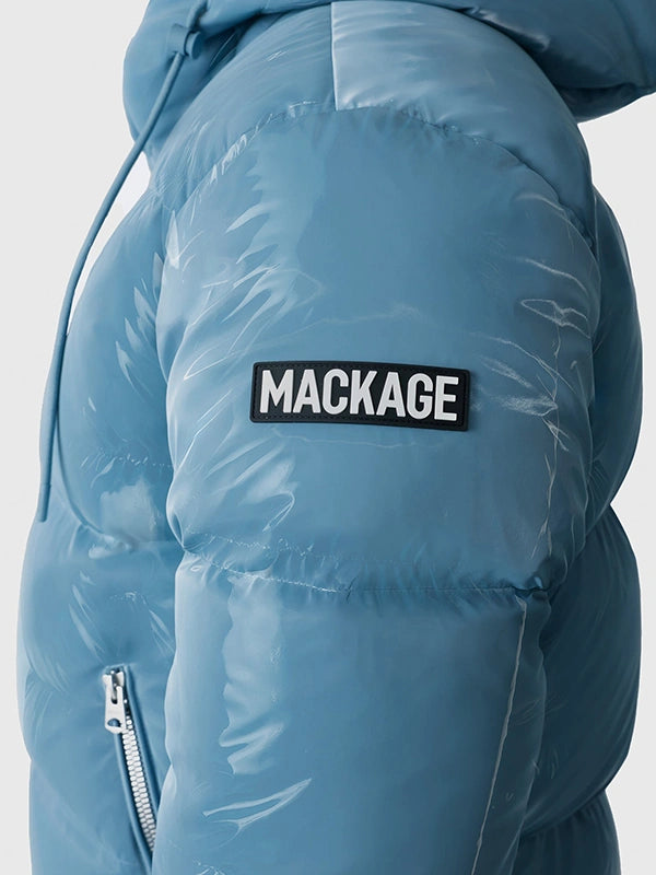 Recreated Andy Cohen NYE 2026 blue Mackage jacket with puffed design and detachable hood for cold-weather layering
