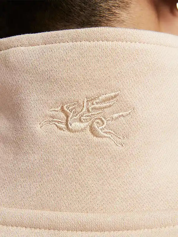 Light beige quarter-zip sweatshirt inspired by Nike Sportswear China 2026 Year of the Horse collection with relaxed fit