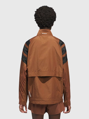 RECREATED Adidas Humanrace x Pharrell Williams 2026 Adizero Archive Brown Running Jacket showcasing a contemporary performance profile with clean athletic detailing