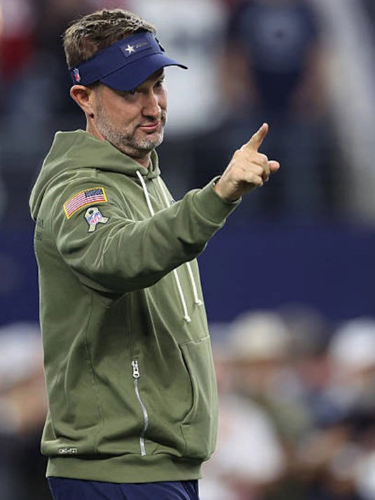 Dallas Cowboys Salute to Service 2025 Hoodie featuring Brian Schottenheimer design and durable fleece texture.