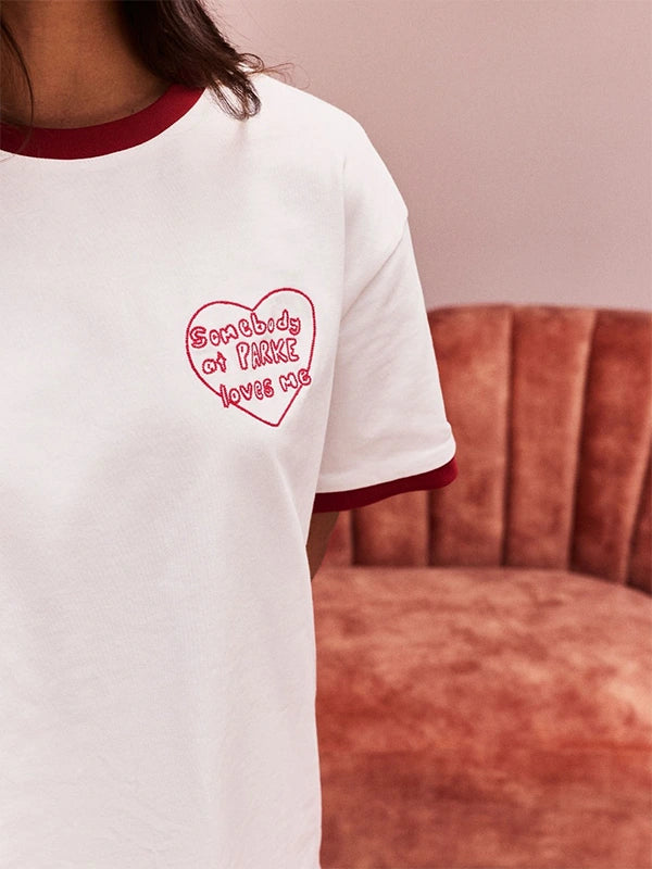 White RECREATED Parke Valentine’s 2026 Somebody At Parke Loves Me t-shirt with smooth cotton fabric
