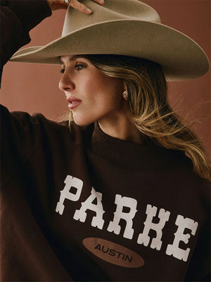 Recreated Austin Signature sweatshirt in brown crafted from soft fleece with a tailored mockneck.