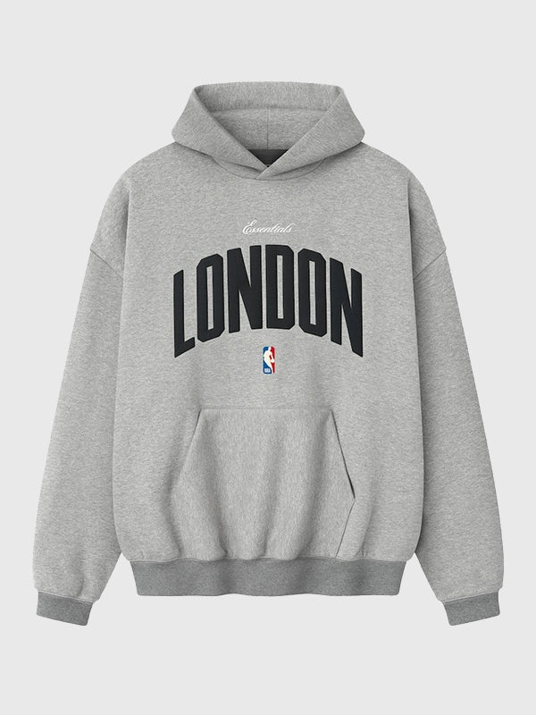 Oversized grey fleece hoodie from Fear of God x London Game 90s collection with vintage athletic styling
