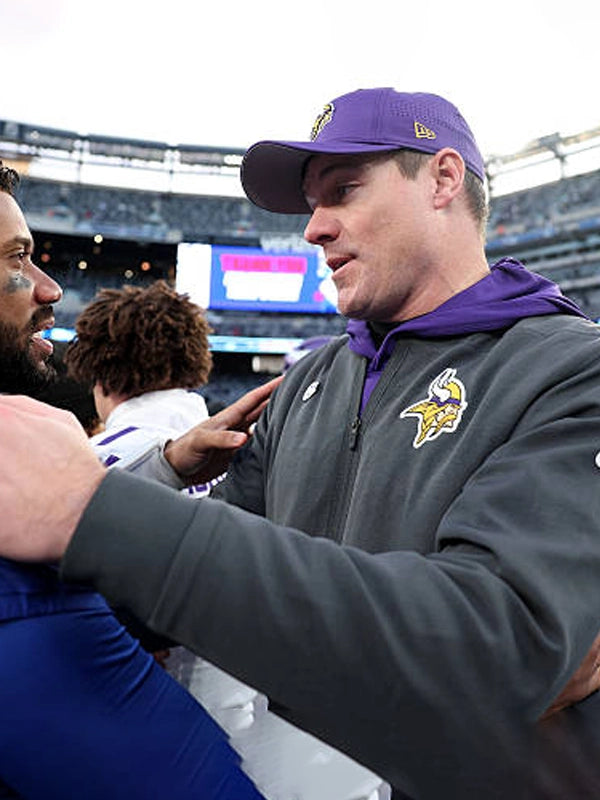 Nike-designed Minnesota Vikings black bomber jacket reflecting Kevin O’Connell’s 2025 sideline look