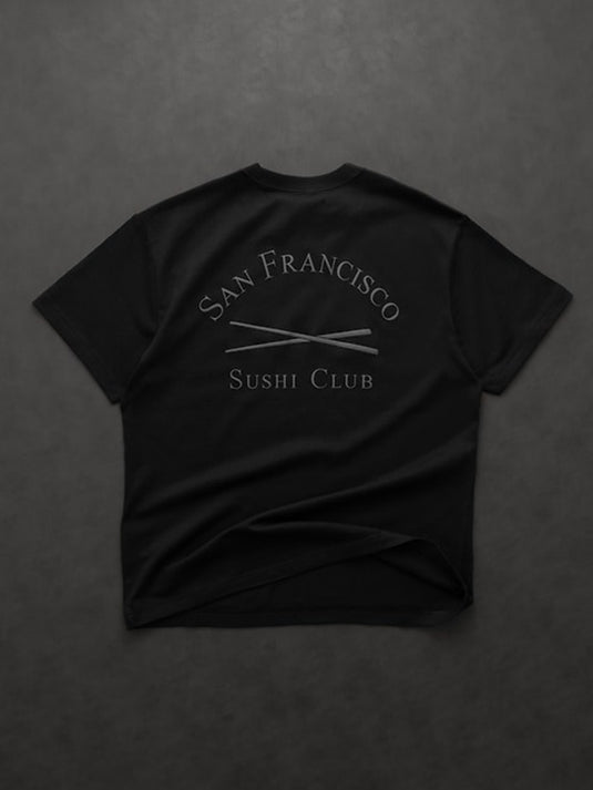 Recreated oversized black T‑shirt from Gap × Sushi Club with bold graphic and dropped shoulder styling