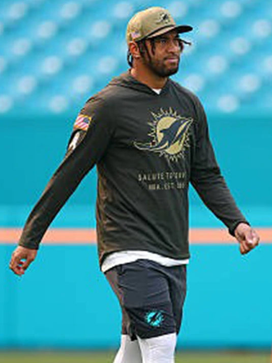Salute to Service 2025 Miami Dolphins hooded pullover T-shirt in forest green, styled like Tua Tagovailoa’s sideline gear.