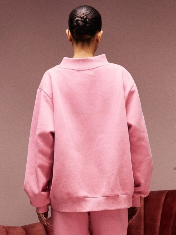 Pink RECREATED Women’s Parke Jean Heart 2026 varsity sweatshirt designed with cozy fleece and a structured fit
