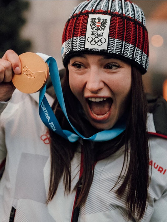 Recreated Milano Cortina 2026 winter hooded jacket in grey for Team Austria with minimalist styling and practical warmth