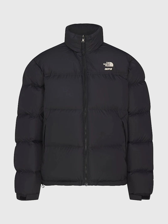 Recreated 1996 Nuptse black parachute puffer jacket from The North Face × SKIMS with lightweight insulation and classic design.