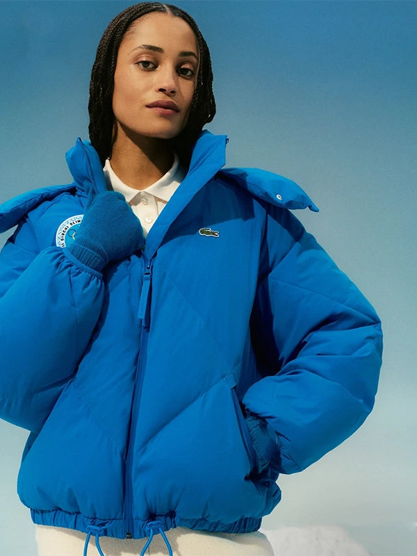 Recreation hooded puffer jacket in blue combining Lacoste craftsmanship with Cortina d’Ampezzo 1956 Olympic Heritage styling