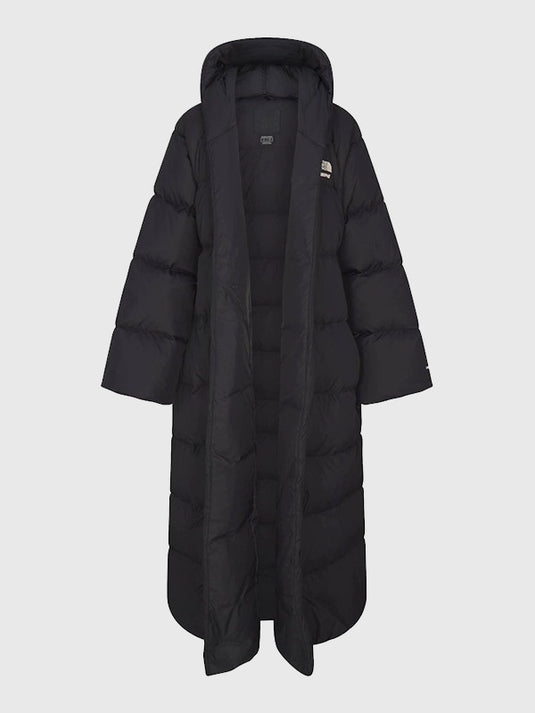 The North Face × SKIMS black wrap-style Nuptse parka recreated with thick insulation and sleek winter-ready design.