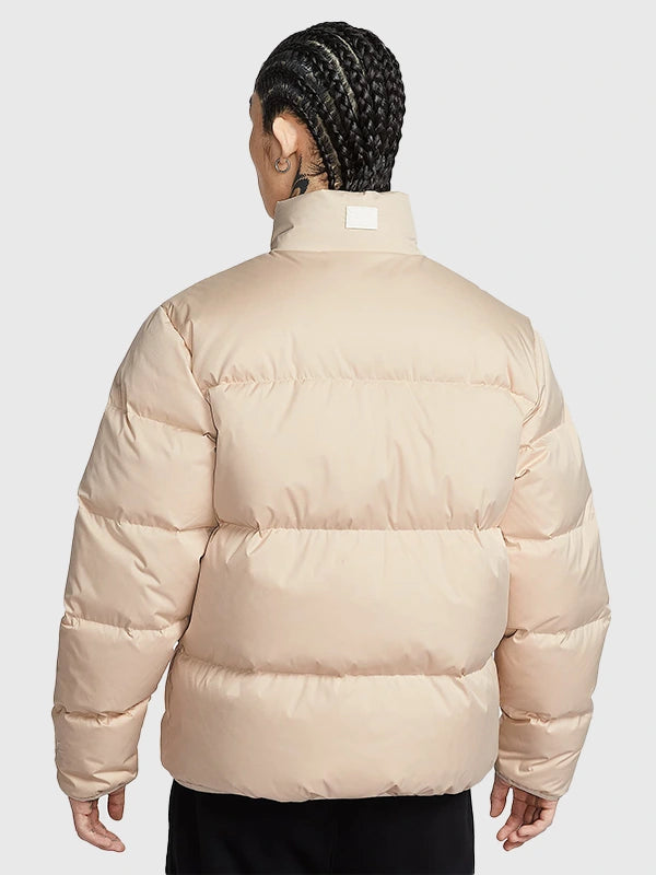 Nike limited edition full-zip puffer jacket in light beige featuring lightweight parachute material and warm insulation