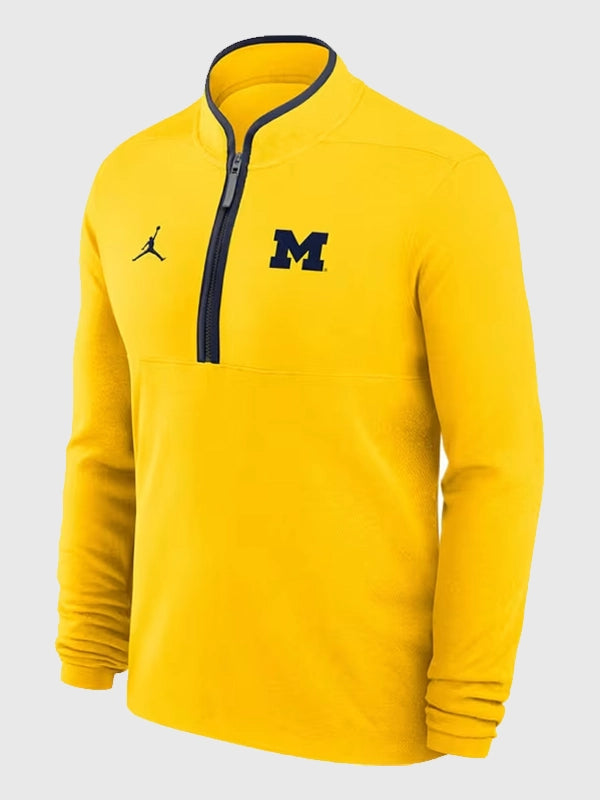Yellow Michigan Wolverines Jordan Victory quarter zip pullover recreated with long sleeves, smooth fabric, and modern performance styling