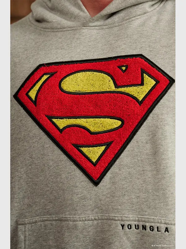 Grey fleece pullover hoodie inspired by Superman Legacy theme featuring oversized streetwear silhouette